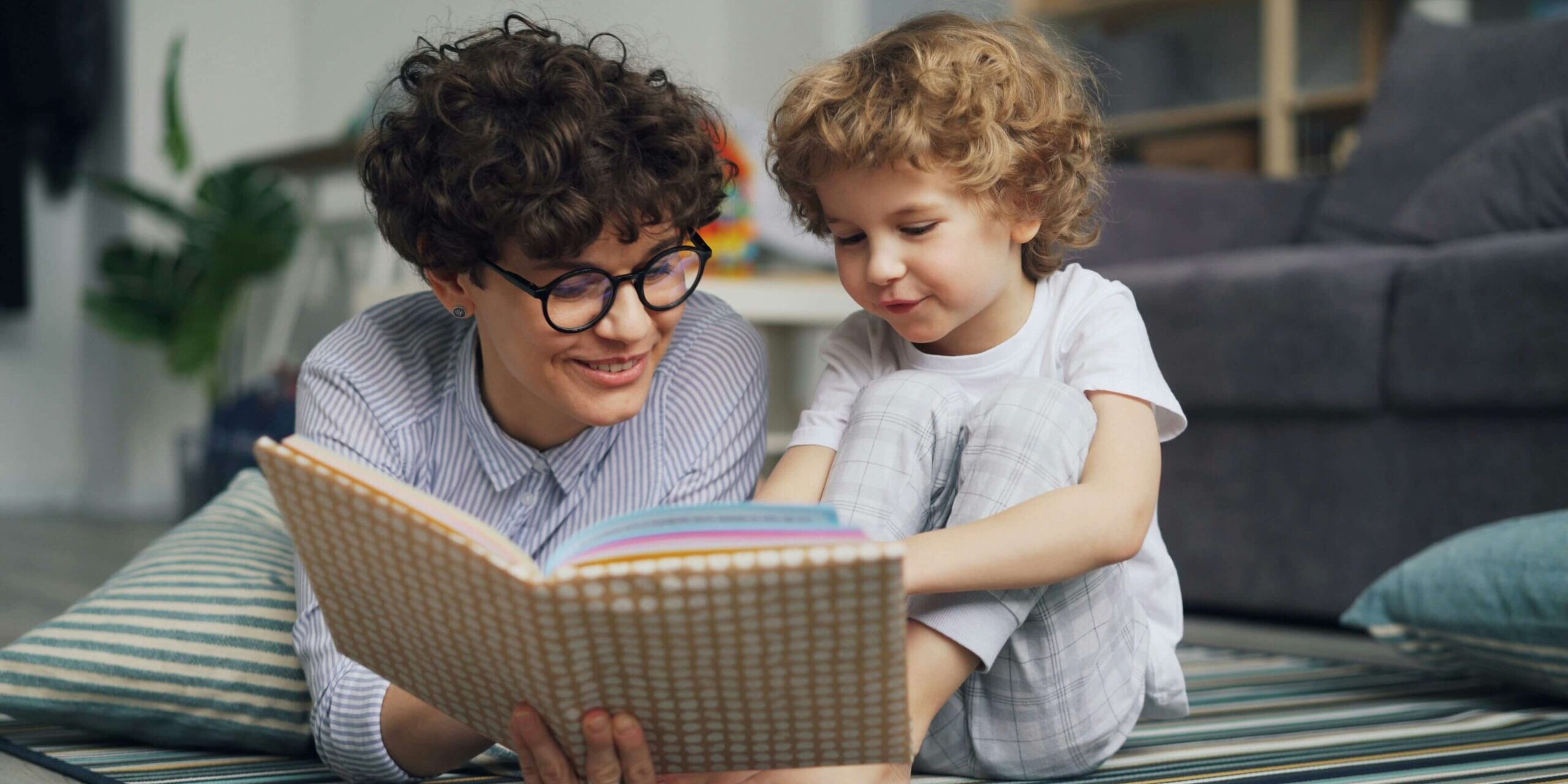 Child working on reading task with adult guidance, learning disability assessment Denver CO